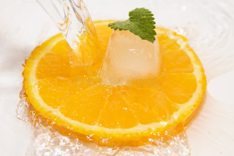 Juicy oranges slice with ice and mint. Juicy oranges slice with ice and mint